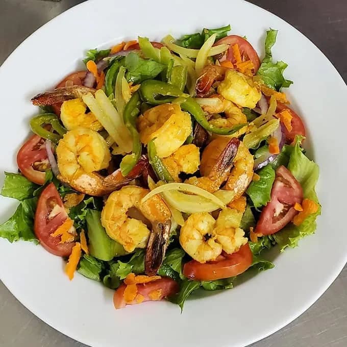 Grilled shrimp salad with tomato and avocado