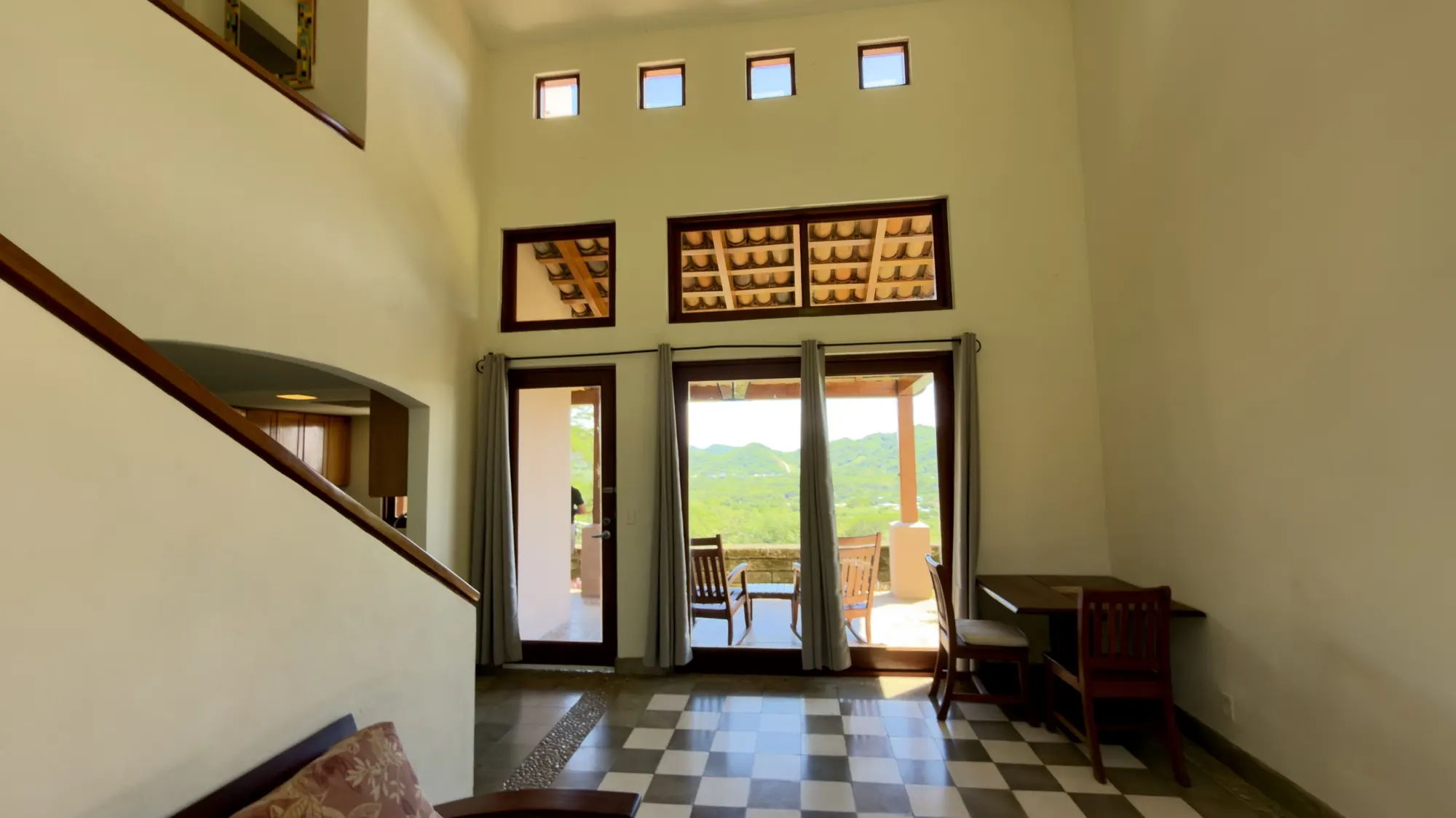 Double-height living room opening onto the terrace